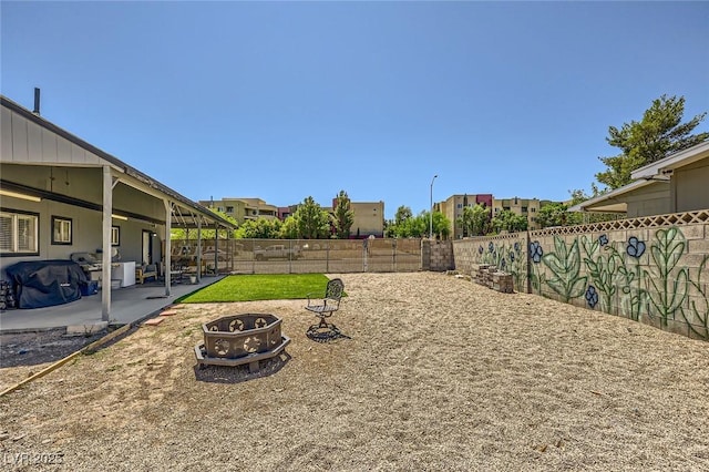 80 E Texas Ave, Henderson, NV 89015 - fenced backyard with an outdoor fire pit and a patio