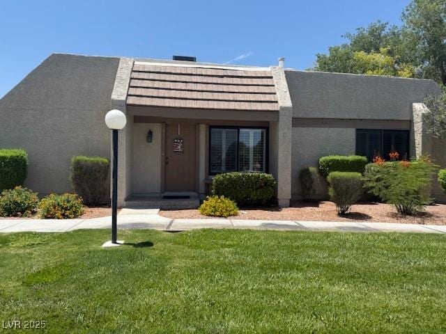 3368 Saddleback Ct, Las Vegas, NV 89121 - view of front of property with a front lawn and stucco siding
