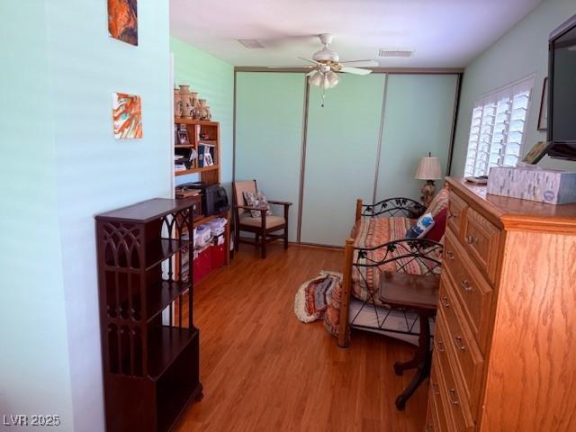 3368 Saddleback Ct, Las Vegas, NV 89121 - living area with wood finished floors and a ceiling fan