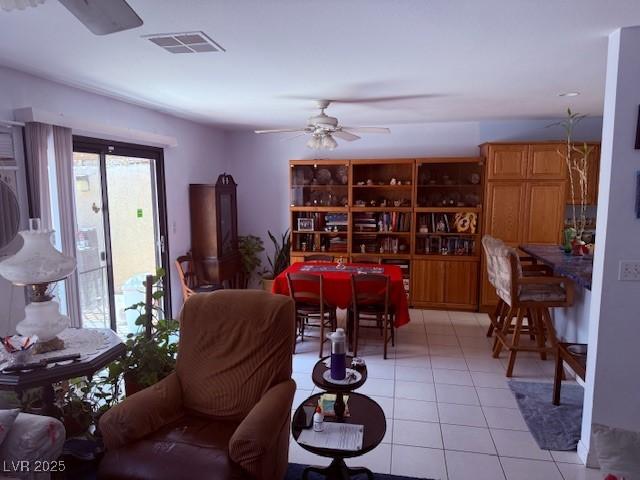 3368 Saddleback Ct, Las Vegas, NV 89121 - living room with light tile patterned floors and ceiling fan