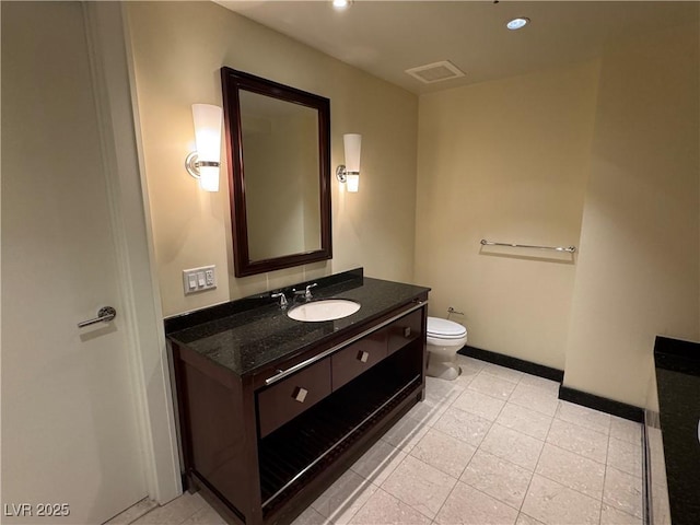 2700 Las Vegas Blvd Unit 2811, Las Vegas, NV 89109 - bathroom featuring vanity, toilet, recessed lighting, tile patterned flooring, and baseboards