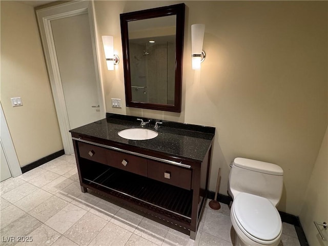2700 Las Vegas Blvd Unit 2811, Las Vegas, NV 89109 - bathroom with baseboards, vanity, and toilet