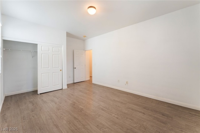 908 Cypress Gold Ct, North Las Vegas, NV 89031 - unfurnished bedroom featuring wood finished floors, baseboards, and a closet