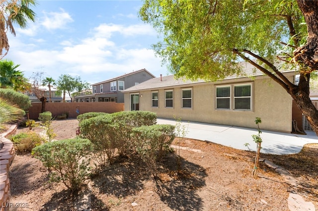 908 Cypress Gold Ct, North Las Vegas, NV 89031 - back of property featuring stucco siding and a patio area