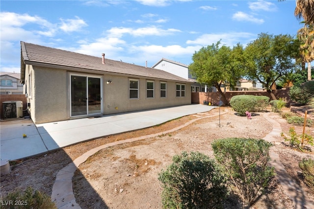 908 Cypress Gold Ct, North Las Vegas, NV 89031 - back of property with central AC, stucco siding, a patio area, and a tile roof