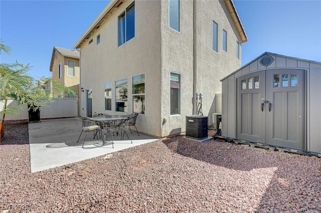 2586 Begonia Valley Ave, Henderson, NV 89074 - back of property with stucco siding, central air condition unit, and a patio area