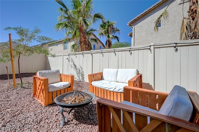 2586 Begonia Valley Ave, Henderson, NV 89074 - fenced backyard with an outdoor fire pit