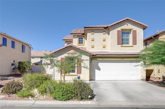2586 Begonia Valley Ave, Henderson, NV 89074 - view of front facade featuring a tiled roof, a garage, driveway, and stucco siding