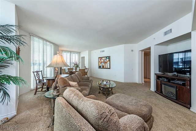 2877 Paradise Rd Unit 906, Las Vegas, NV 89109 - living room with light carpet and baseboards
