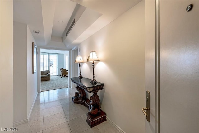 2877 Paradise Rd Unit 906, Las Vegas, NV 89109 - corridor with baseboards and a raised ceiling
