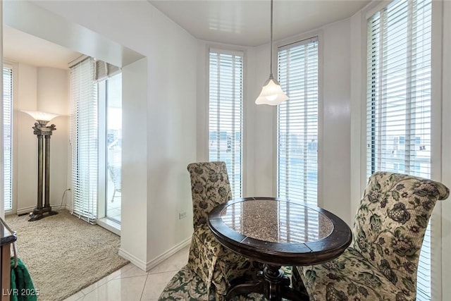 2877 Paradise Rd Unit 906, Las Vegas, NV 89109 - dining area featuring light tile patterned floors, light colored carpet, and baseboards