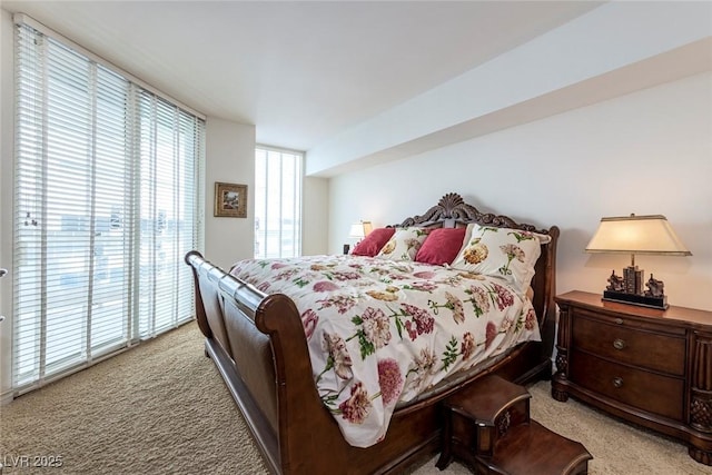 2877 Paradise Rd Unit 906, Las Vegas, NV 89109 - bedroom with light colored carpet and access to exterior
