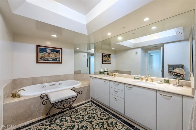 2877 Paradise Rd Unit 906, Las Vegas, NV 89109 - full bathroom featuring double vanity, a garden tub, and recessed lighting