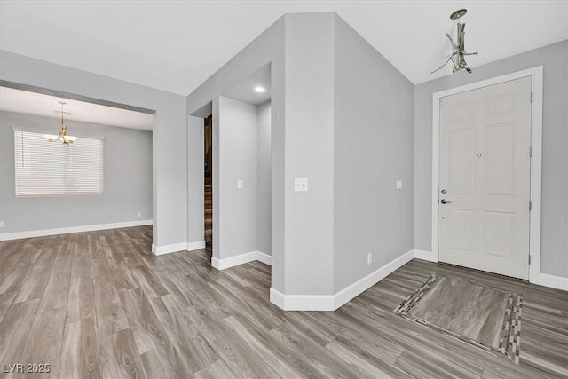 9010 Wine Cellar Ave, Las Vegas, NV 89148 - entrance foyer with a chandelier, wood finished floors, baseboards, and recessed lighting