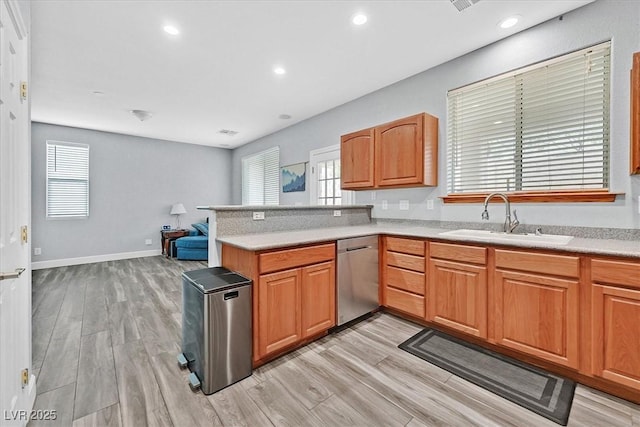 9010 Wine Cellar Ave, Las Vegas, NV 89148 - kitchen with dishwasher, a sink, a peninsula, light countertops, and recessed lighting