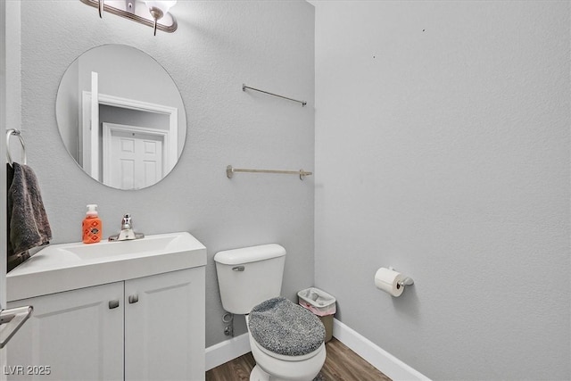 9010 Wine Cellar Ave, Las Vegas, NV 89148 - bathroom featuring vanity, wood finished floors, toilet, and baseboards