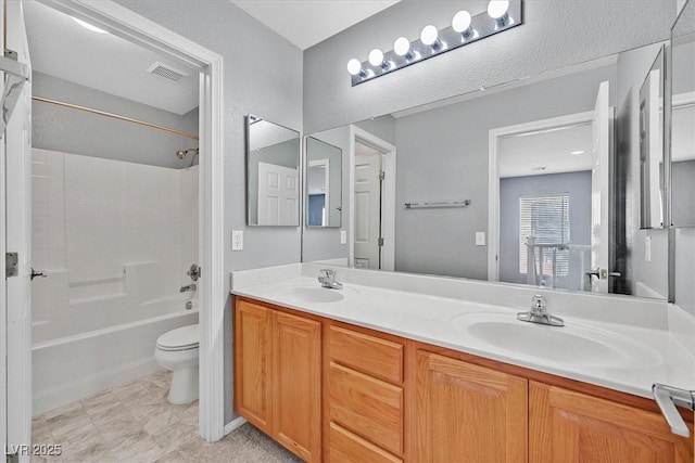 9010 Wine Cellar Ave, Las Vegas, NV 89148 - bathroom featuring toilet, double vanity, and shower / bathtub combination