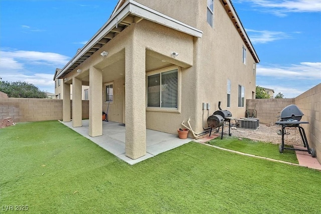 9010 Wine Cellar Ave, Las Vegas, NV 89148 - rear view of house with stucco siding, a patio area, and central AC