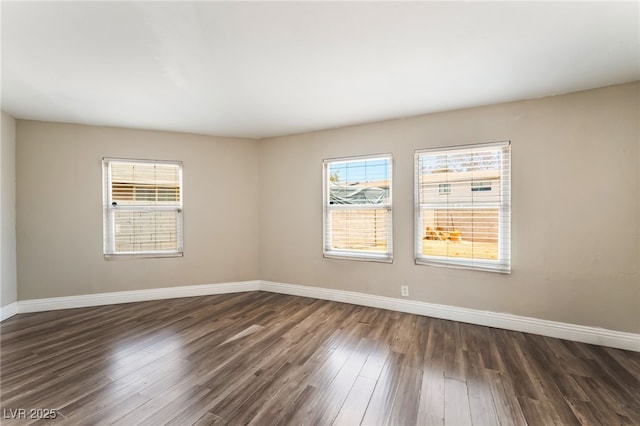 2301 Maverick St, Las Vegas, NV 89108 - empty room featuring dark wood finished floors, healthy amount of natural light, and baseboards