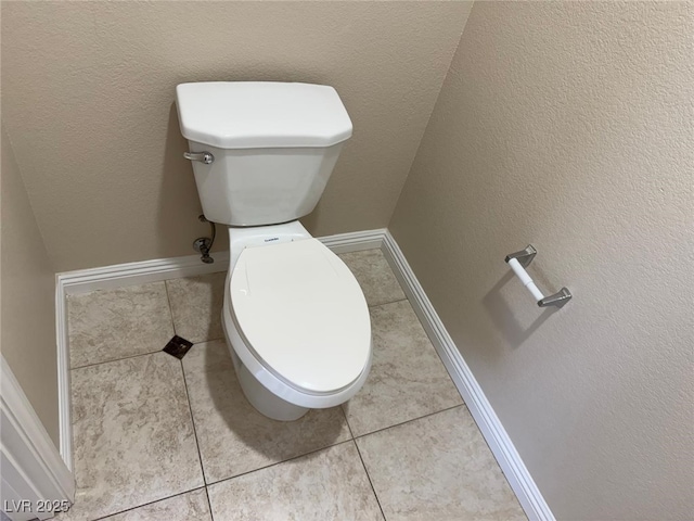 10118 Farmington Hall Ct, Las Vegas, NV 89129 - bathroom with toilet, baseboards, and tile patterned floors