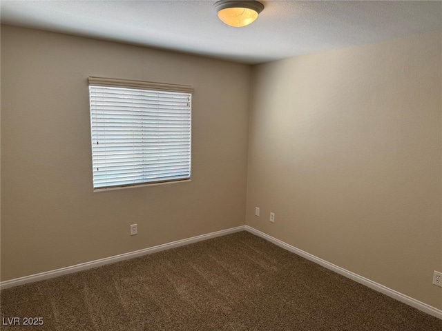 10118 Farmington Hall Ct, Las Vegas, NV 89129 - empty room with dark colored carpet and baseboards