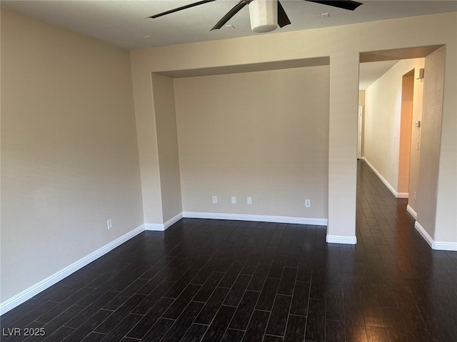 10118 Farmington Hall Ct, Las Vegas, NV 89129 - empty room with dark wood-style floors, ceiling fan, and baseboards