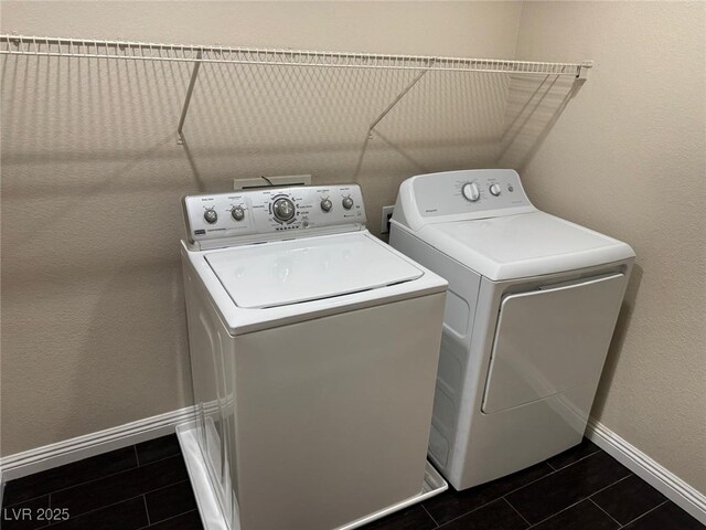 10118 Farmington Hall Ct, Las Vegas, NV 89129 - laundry room featuring washing machine and clothes dryer and dark tile patterned floors
