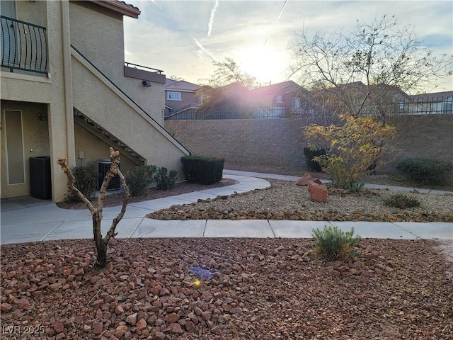 5710 E Tropicana Ave Unit 1172, Las Vegas, NV 89122 - view of yard with stairs and central AC