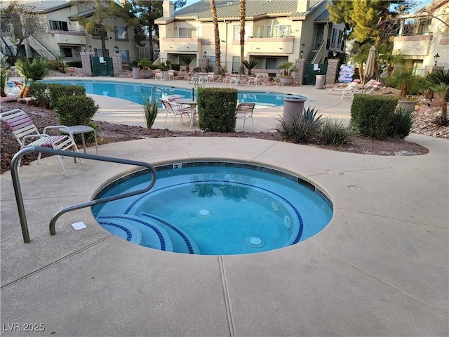 5710 E Tropicana Ave Unit 1172, Las Vegas, NV 89122 - community pool featuring a community hot tub and a patio