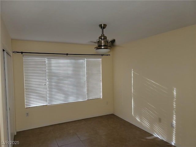 5710 E Tropicana Ave Unit 1172, Las Vegas, NV 89122 - empty room with tile patterned floors and baseboards