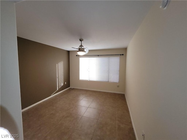 5710 E Tropicana Ave Unit 1172, Las Vegas, NV 89122 - spare room with baseboards and tile patterned floors