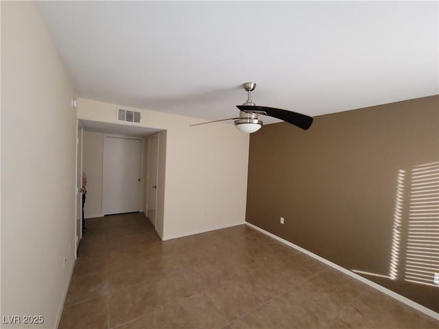 5710 E Tropicana Ave Unit 1172, Las Vegas, NV 89122 - empty room featuring a ceiling fan and baseboards