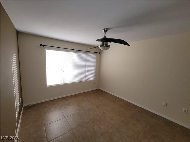 5710 E Tropicana Ave Unit 1172, Las Vegas, NV 89122 - empty room with a ceiling fan, baseboards, and tile patterned flooring