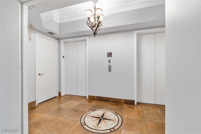 2857 Paradise Rd Unit 301, Las Vegas, NV 89109 - corridor with elevator, a tray ceiling, a chandelier, and baseboards