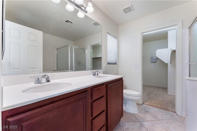 8872 Perfect Diamond Ct, Las Vegas, NV 89129 - bathroom with double vanity, an enclosed shower, tile patterned floors, and toilet