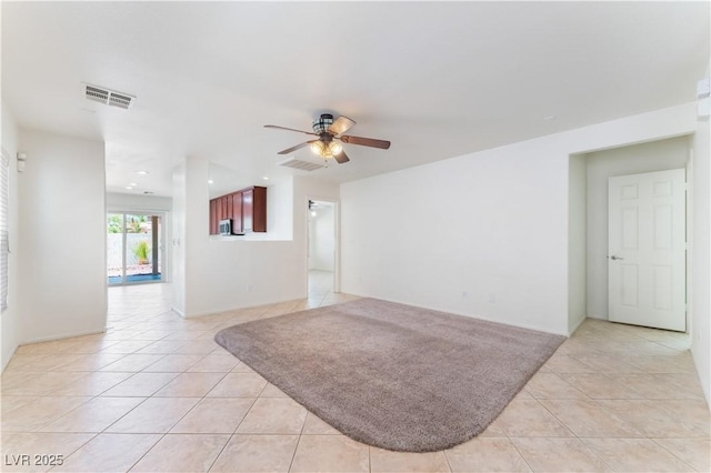 8872 Perfect Diamond Ct, Las Vegas, NV 89129 - unfurnished living room with light tile patterned floors and ceiling fan