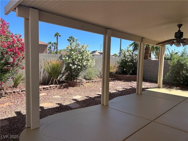 8872 Perfect Diamond Ct, Las Vegas, NV 89129 - fenced backyard with ceiling fan and a patio