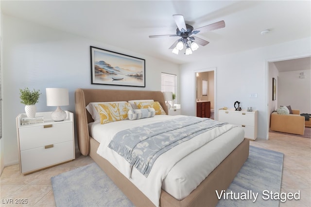 8872 Perfect Diamond Ct, Las Vegas, NV 89129 - bedroom featuring light tile patterned floors, ensuite bath, and ceiling fan