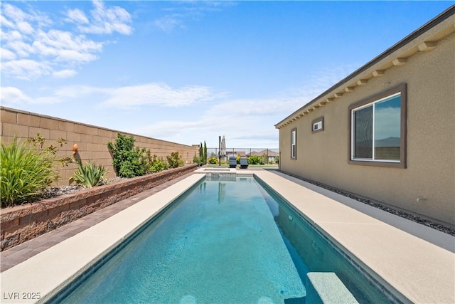 8668 Hartmont St, Las Vegas, NV 89166 - view of pool with a fenced backyard and a pool with connected hot tub