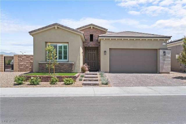 8668 Hartmont St, Las Vegas, NV 89166 - view of front facade with stucco siding, driveway, a garage, and a tile roof
