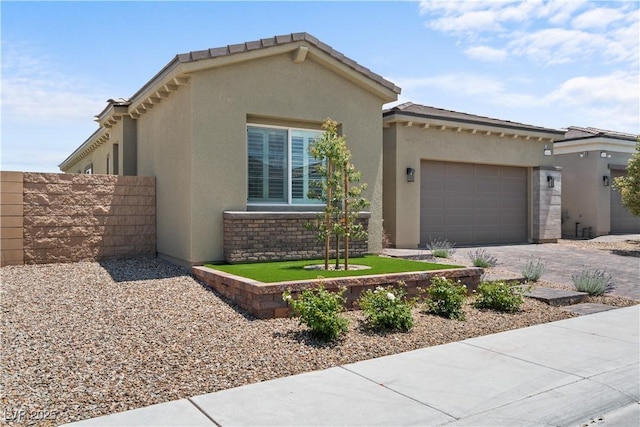 8668 Hartmont St, Las Vegas, NV 89166 - view of front of home featuring a garage, stucco siding, and driveway