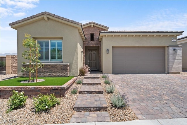 8668 Hartmont St, Las Vegas, NV 89166 - view of front of house featuring stucco siding, an attached garage, decorative driveway, and a tile roof