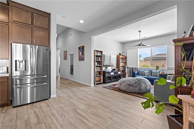 8668 Hartmont St, Las Vegas, NV 89166 - kitchen featuring stainless steel fridge with ice dispenser, light wood-style flooring, ceiling fan, baseboards, and recessed lighting