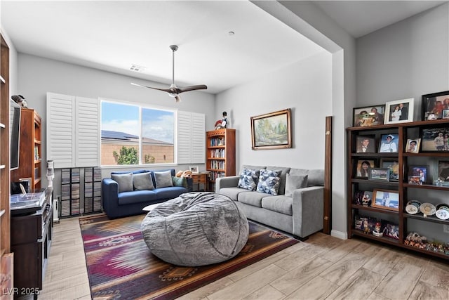 8668 Hartmont St, Las Vegas, NV 89166 - living area featuring light wood-type flooring and ceiling fan