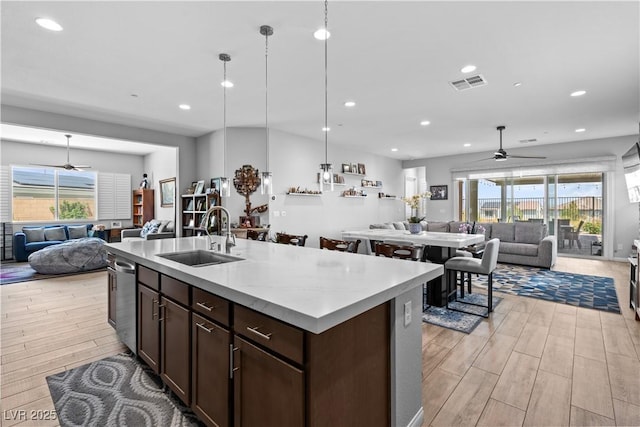 8668 Hartmont St, Las Vegas, NV 89166 - kitchen with open floor plan, ceiling fan, a sink, light wood-type flooring, and recessed lighting