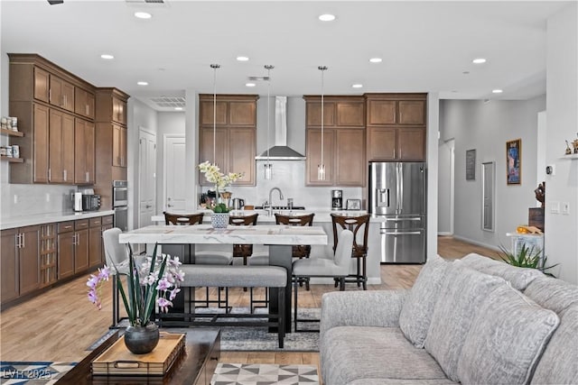 8668 Hartmont St, Las Vegas, NV 89166 - living room featuring recessed lighting and light wood-type flooring