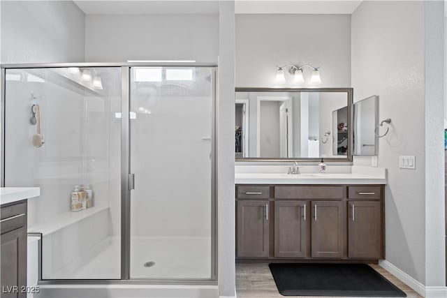 8668 Hartmont St, Las Vegas, NV 89166 - full bath with vanity, a shower stall, and wood finished floors