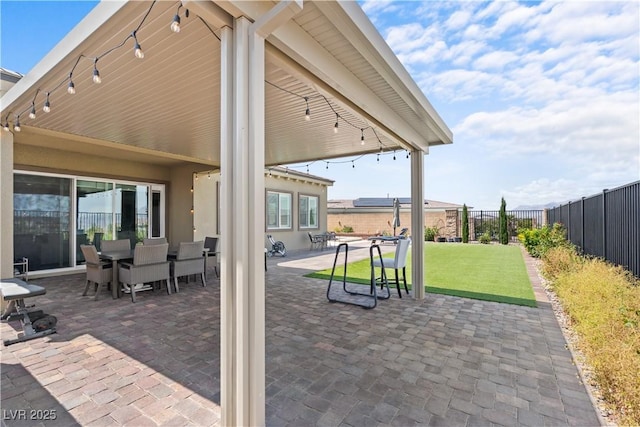 8668 Hartmont St, Las Vegas, NV 89166 - fenced backyard featuring a patio area and outdoor dining area