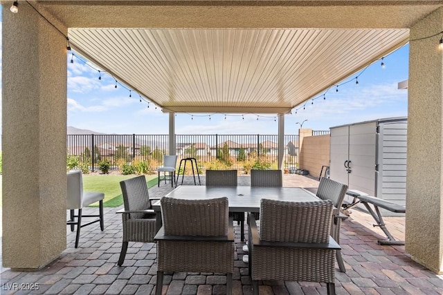 8668 Hartmont St, Las Vegas, NV 89166 - fenced backyard with a patio area and outdoor dining area