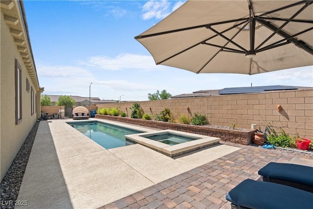 8668 Hartmont St, Las Vegas, NV 89166 - view of pool with an in-ground hot tub, a fenced backyard, and a patio area
